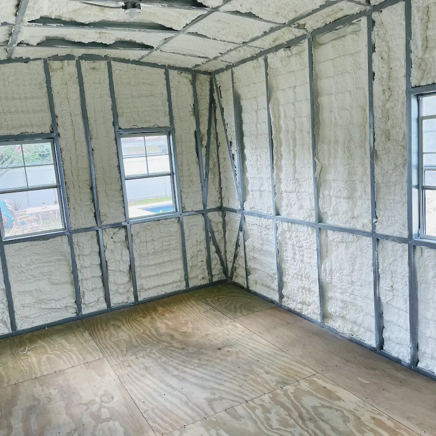 Closed-cell spray foam insulation applied to wall cavities in a residential project in Countryside